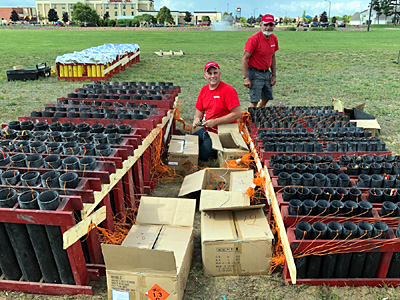 Loading fireworks mortars at Chrome Fireorks public display